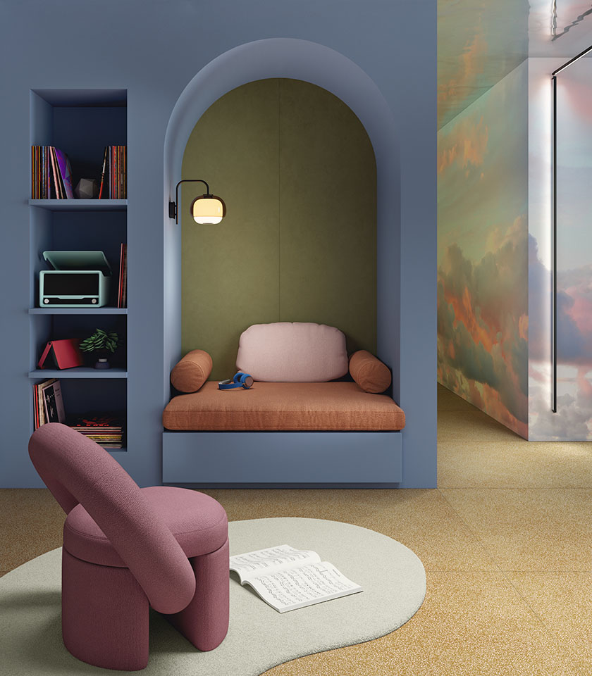 Ambiente moderno con colori morbidi, pavimento materico e una nicchia accogliente.