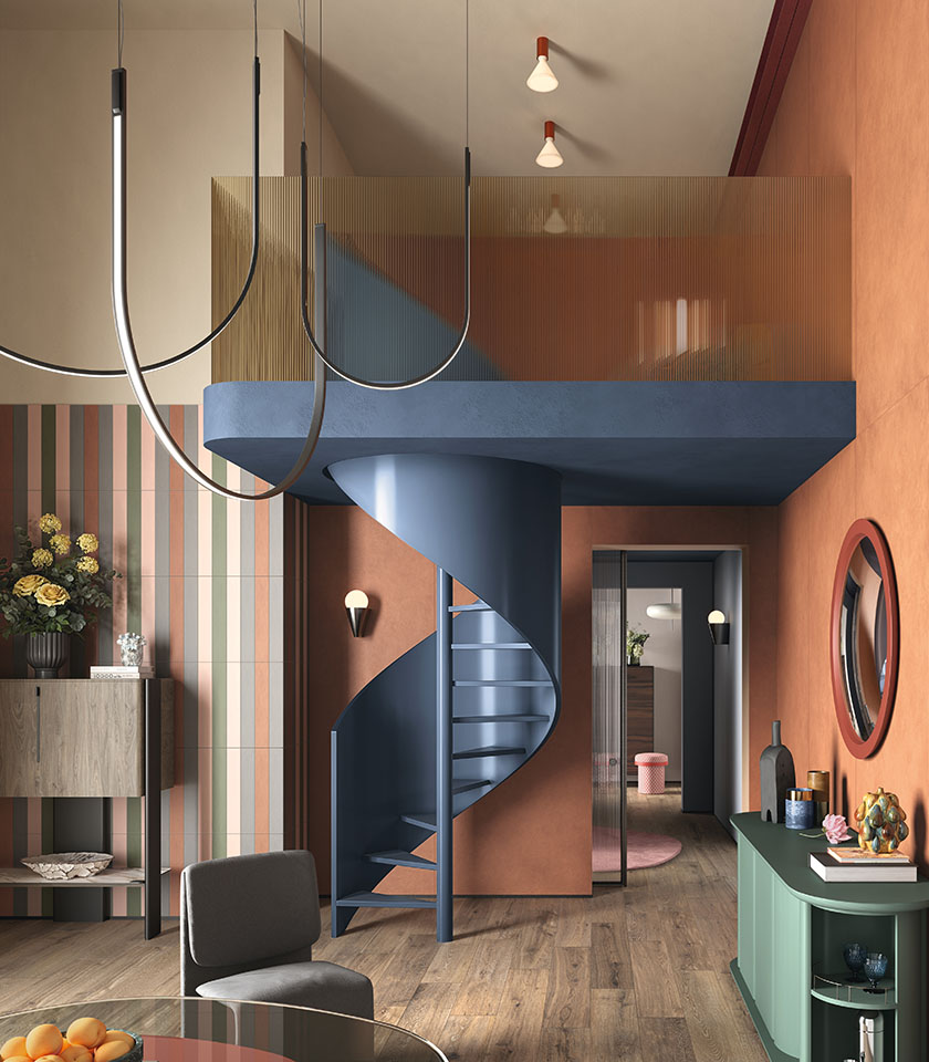 Bio Attitude Cortex definisce un living caldo e dinamico, dove il fascino del legno ceramico dialoga con superfici colorate e dettagli grafici dal carattere contemporaneo.