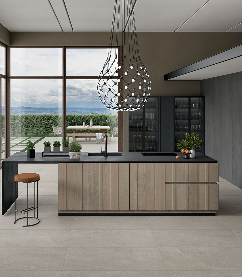Cucina contemporanea con superfici Nextone di Lea Ceramiche: gres porcellanato effetto pietra per ambienti eleganti, funzionali e continui.